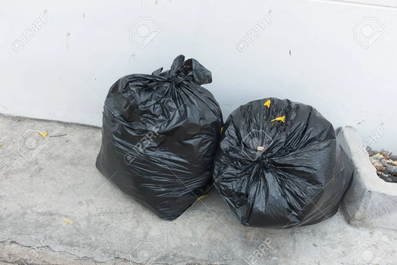 59876050-plastic-trash-bags-on-outside-street